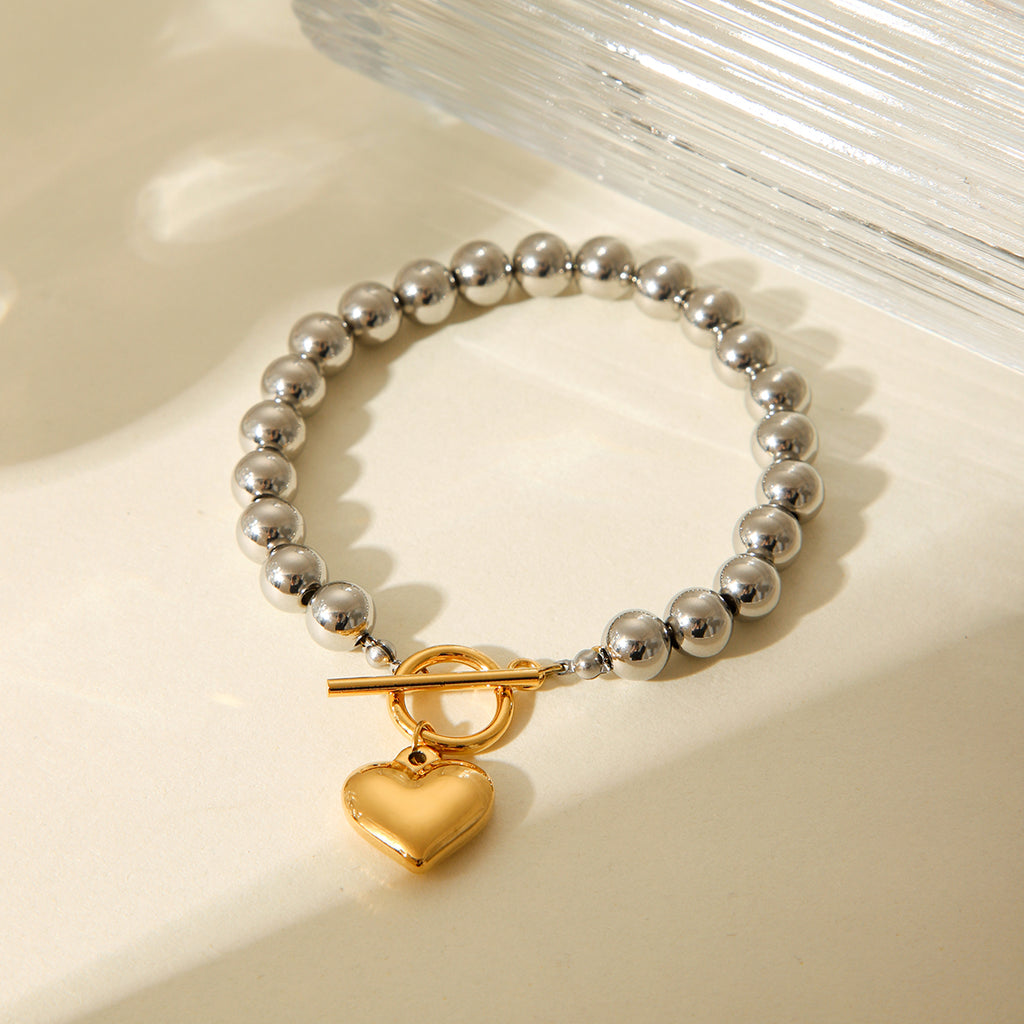 BRACCIALE SFERE LUMINOSE IN ARGENTO CON PENDOLO A CUORE IN ORO ACCIAIO INOX 304 MIS.20,5 CM