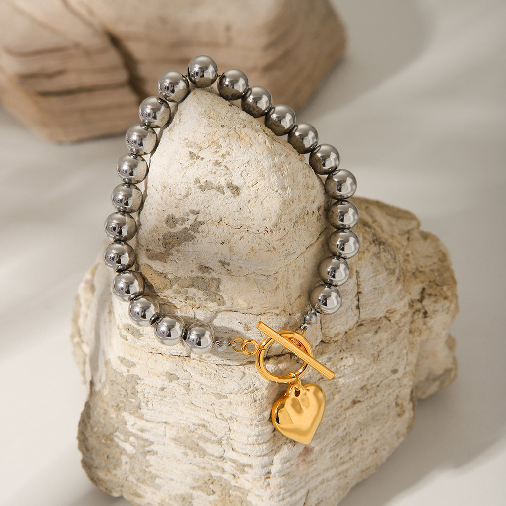 BRACCIALE SFERE LUMINOSE IN ARGENTO CON PENDOLO A CUORE IN ORO ACCIAIO INOX 304 MIS.20,5 CM