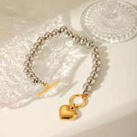 BRACCIALE SFERE LUMINOSE IN ARGENTO CON PENDOLO A CUORE IN ORO ACCIAIO INOX 304 MIS.20,5 CM