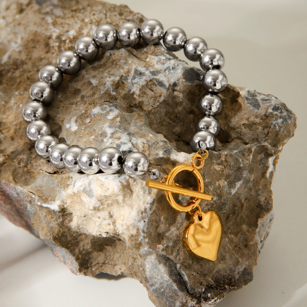 BRACCIALE SFERE LUMINOSE IN ARGENTO CON PENDOLO A CUORE IN ORO ACCIAIO INOX 304 MIS.20,5 CM