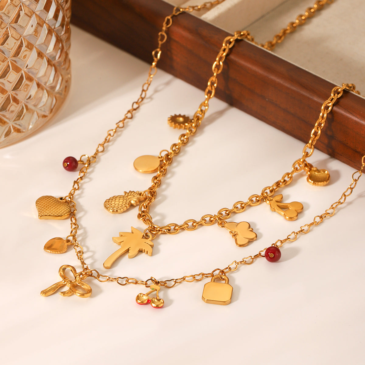 COLLANA FIOCCO CON CIONDOLI E PIETRE ACCIAIO INOX 304 REGOLABILE