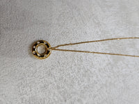 Collana con ciondolo cerchio infinito e zirconi in acciaio inox