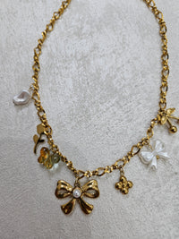 Collana fiocco con charm in acciaio inox