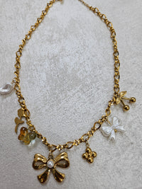 Collana fiocco con charm in acciaio inox