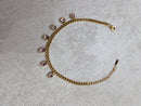 Bracciale con goccie rosa in acciaio inox