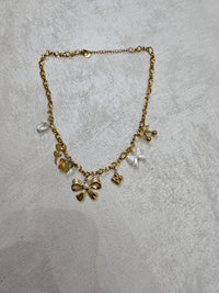 Collana fiocco con charm in acciaio inox
