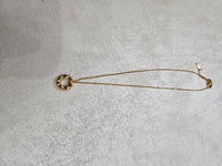 Collana con ciondolo cerchio infinito e zirconi in acciaio inox